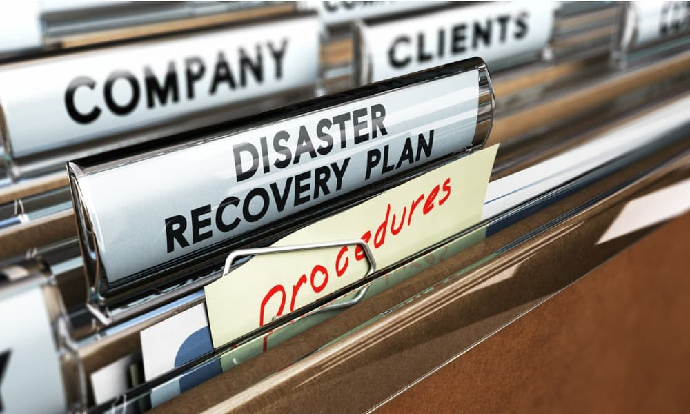 A disaster recovery and business continuity plan in a filing cabinet with company, clients, and procedures documents